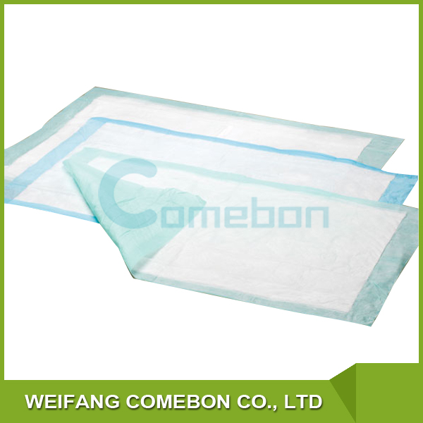 Disposable colored medical fluff pulp underpads
